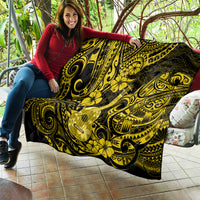 Yellow and black polynesian quilt blanket with ukulele artwork and repeating floral swirls