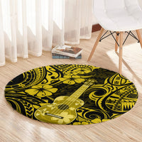 Round yellow and black Polynesian ukulele patterned carpet rug on hardwood