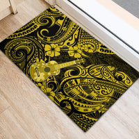 Yellow and black rubber doormat featuring a ukulele and floral scroll patterns