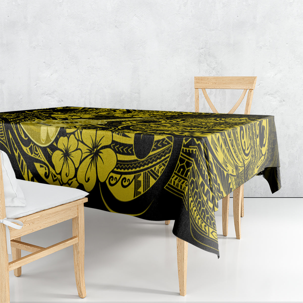 Yellow and black patterned tablecloth draped over rectangular table, scalloped edge