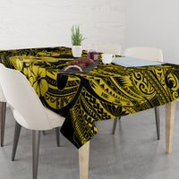 Yellow and black patterned tablecloth on dining table with flower and swirl motifs