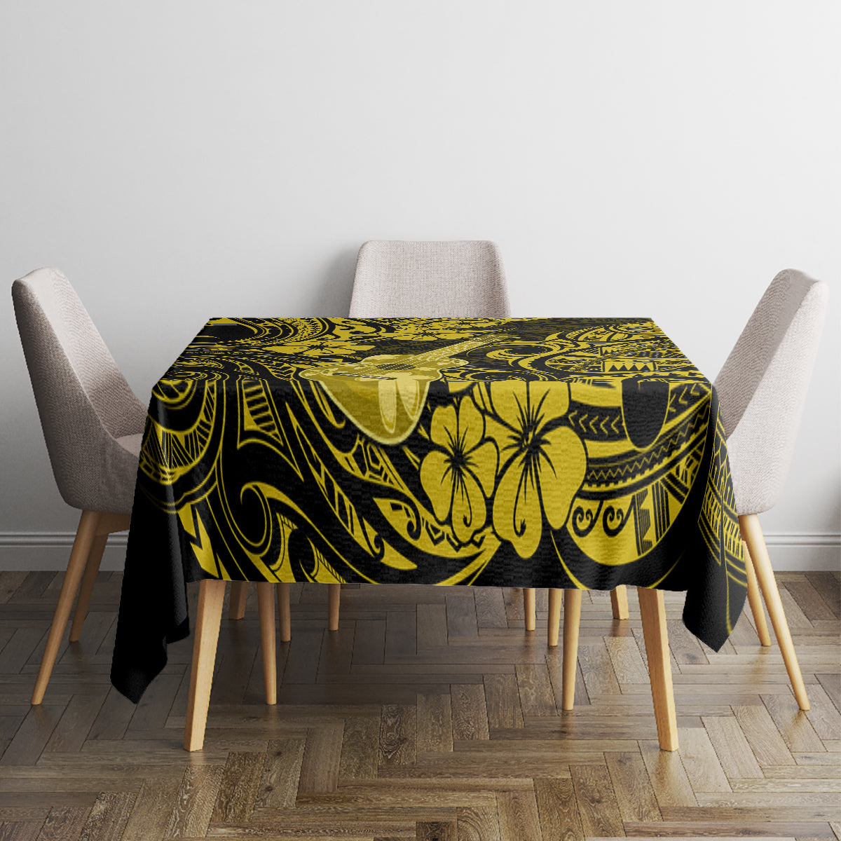 Yellow and black patterned tablecloth with floral, sun-like emblems and swirls
