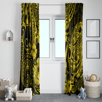 Yellow and black Polynesian pattern curtain panels, full height hanging on a window.