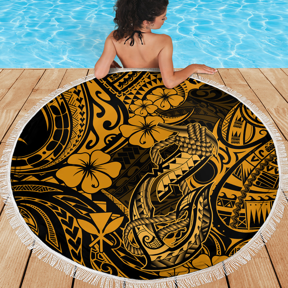 Circular gold and black Polynesian pattern beach blanket with white fringe