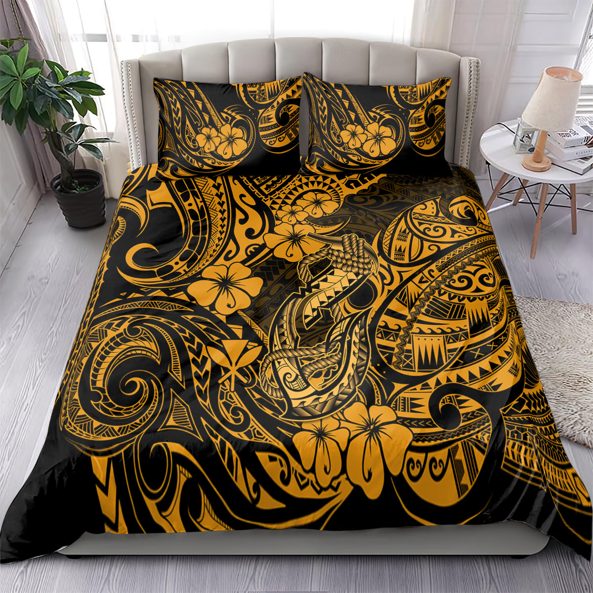 Gold and black Polynesian-pattern bedding set on bed with matching pillowcases