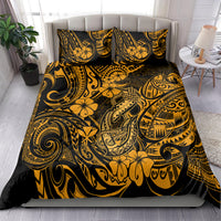 Gold and black Polynesian-pattern bedding set on bed with matching pillowcases