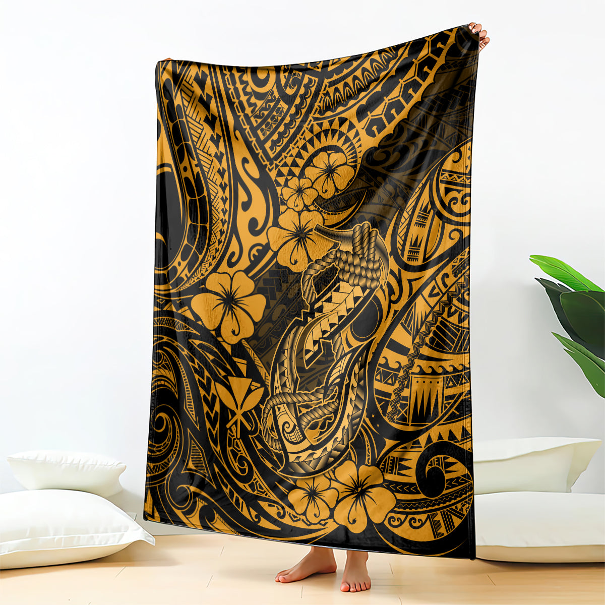 Gold and black Polynesian pattern fish hook throw blanket with floral motifs