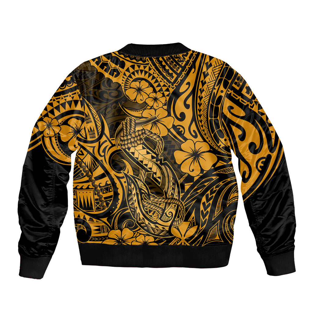 Unisex bomber jacket in gold with black sleeves and Polynesian fish-hook back print