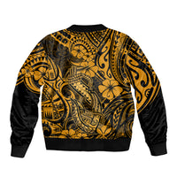 Unisex bomber jacket in gold with black sleeves and Polynesian fish-hook back print