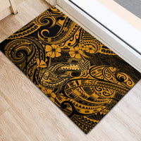 Polynesian fish hook rubber doormat with gold floral and geometric pattern on black