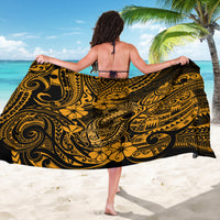 Gold and black patterned sarong wrap skirt, back view with waist tie and swirls