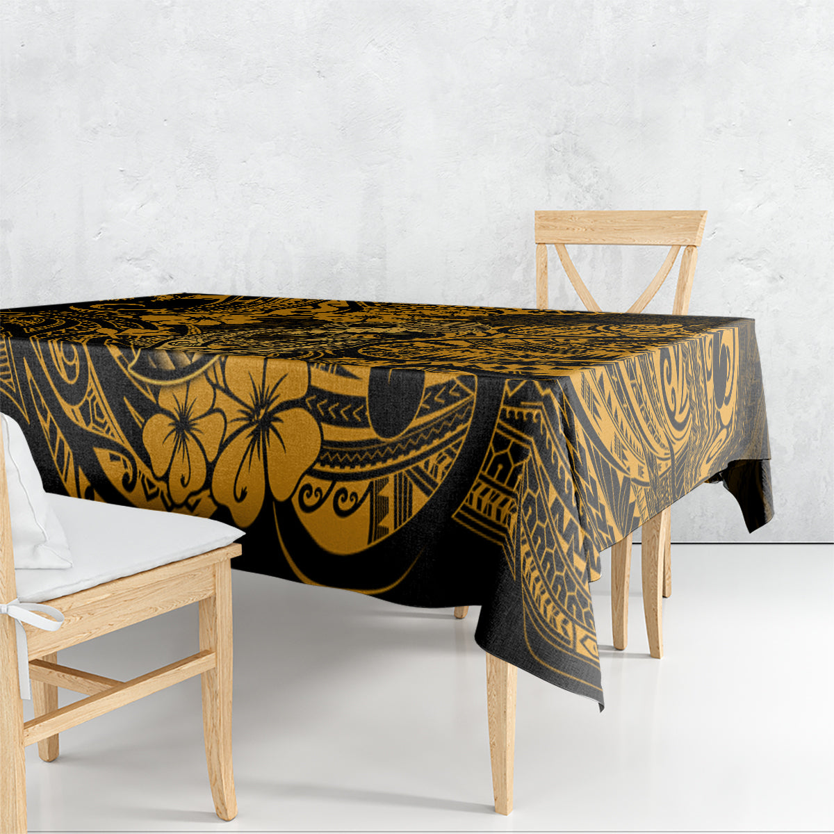 Black and gold patterned tablecloth draped over a table, with detailed Polynesian motifs.