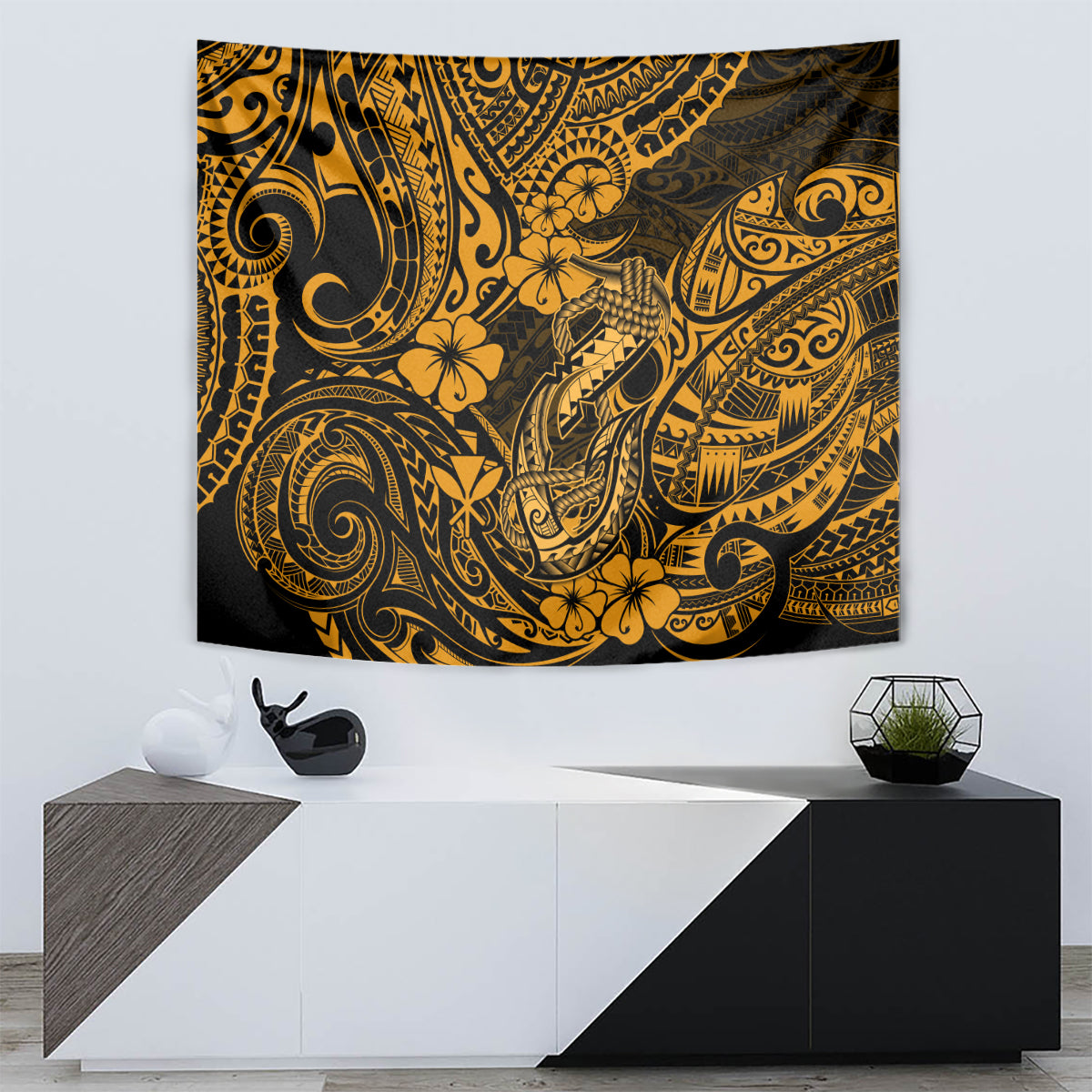 Gold and black Polynesian fish hook tapestry wall hanging with floral and wave motifs