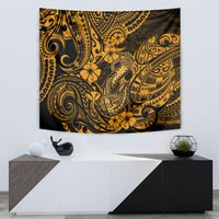 Gold and black Polynesian fish hook tapestry wall hanging with floral and wave motifs