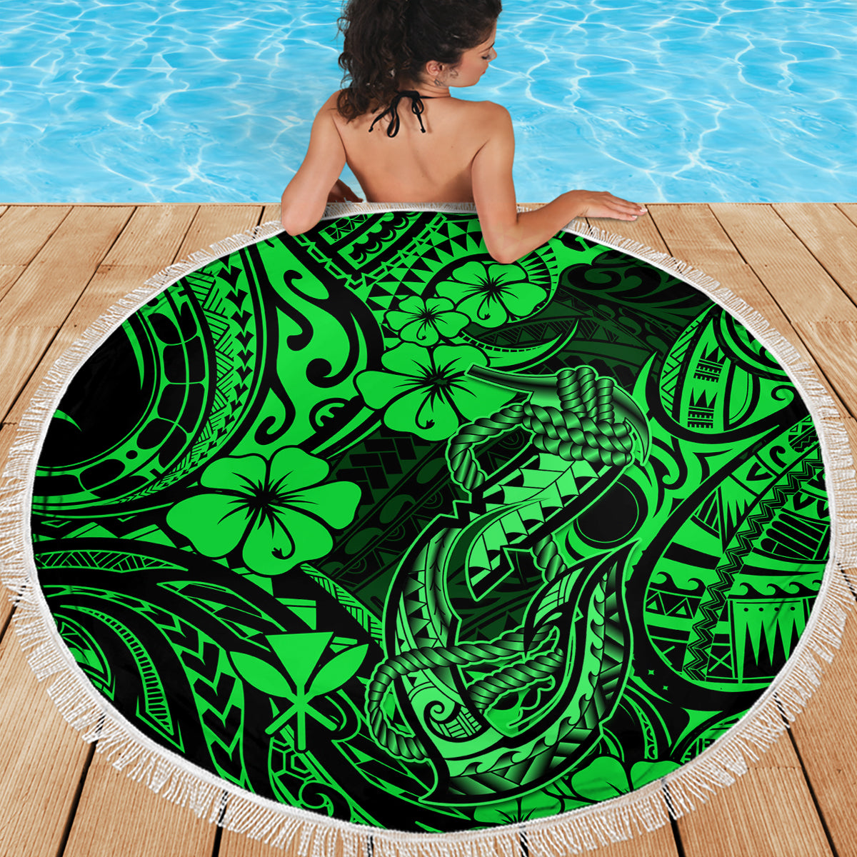 Round green Polynesian beach blanket with white fringe edge