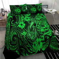 Green Polynesian fish hook patterned comforter with two coordinating pillowcases