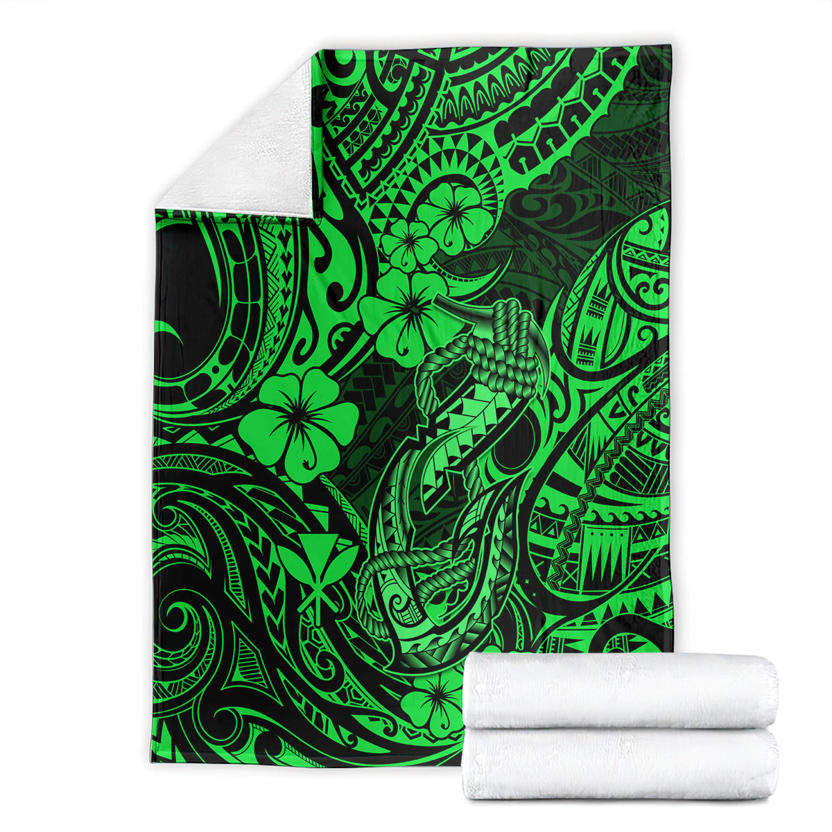 Green Polynesian fish hook blanket shown with folded stacks and tribal print