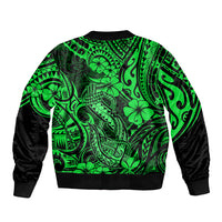 Green bomber jacket with Polynesian fish-hook pattern, ribbed cuffs and hem, black sleeves