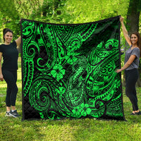 Green Polynesian fish-hook quilt with clover and swirl motifs, spread flat