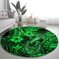 Round green Polynesian pattern rug with fishhook and sea motifs, centered in living room view.