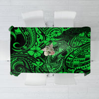 Green Polynesian patterned tablecloth with fish hook motif, rectangular design
