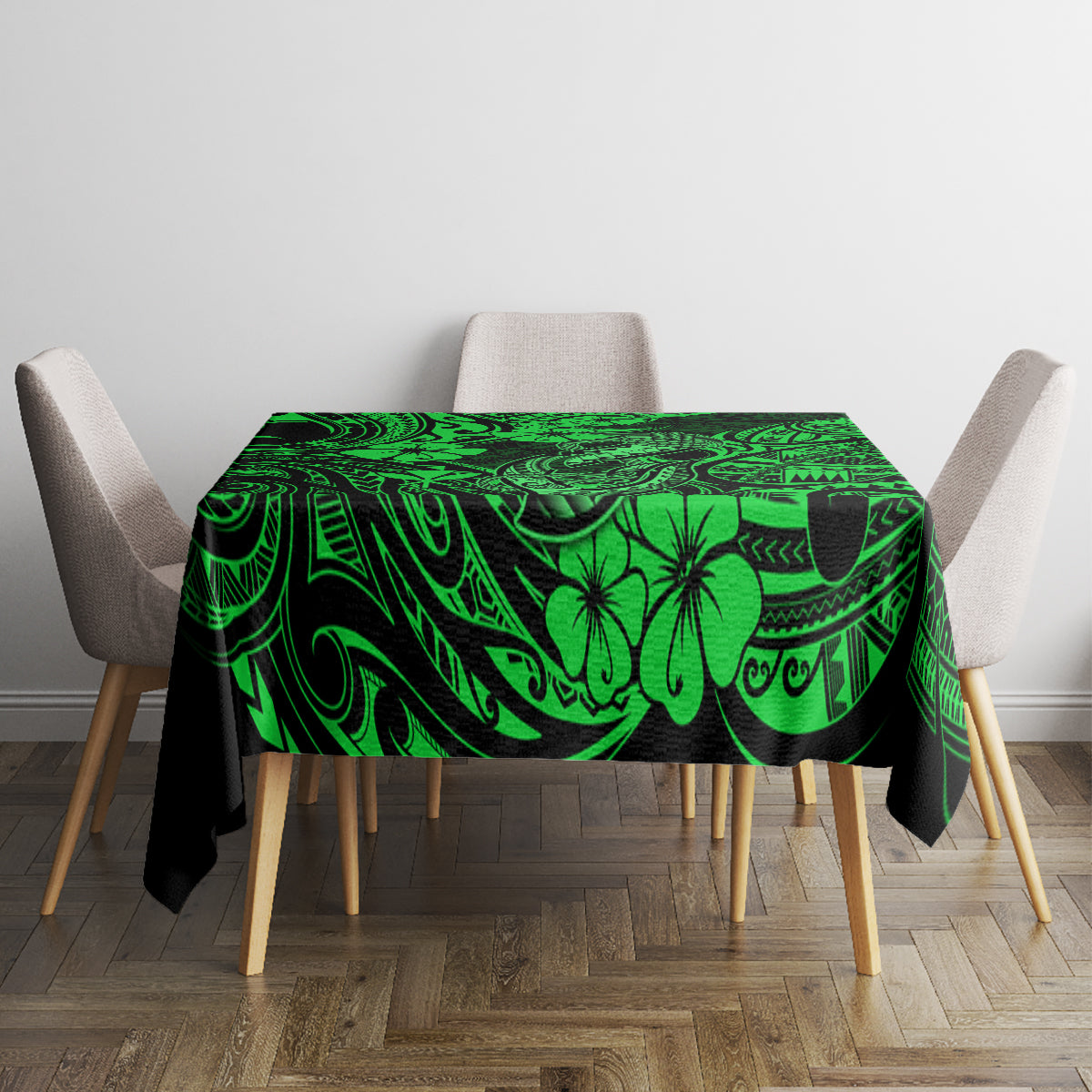Green Polynesian tablecloth with ornate swirls, palm and hook motifs, square over table