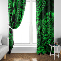 Green patterned window curtain pair hanging at a white window opening