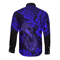 Back of navy long-sleeve button shirt with blue Polynesian fish hook and floral pattern