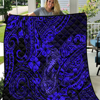 Navy quilt blanket with Polynesian fish-hook and hibiscus swirl pattern
