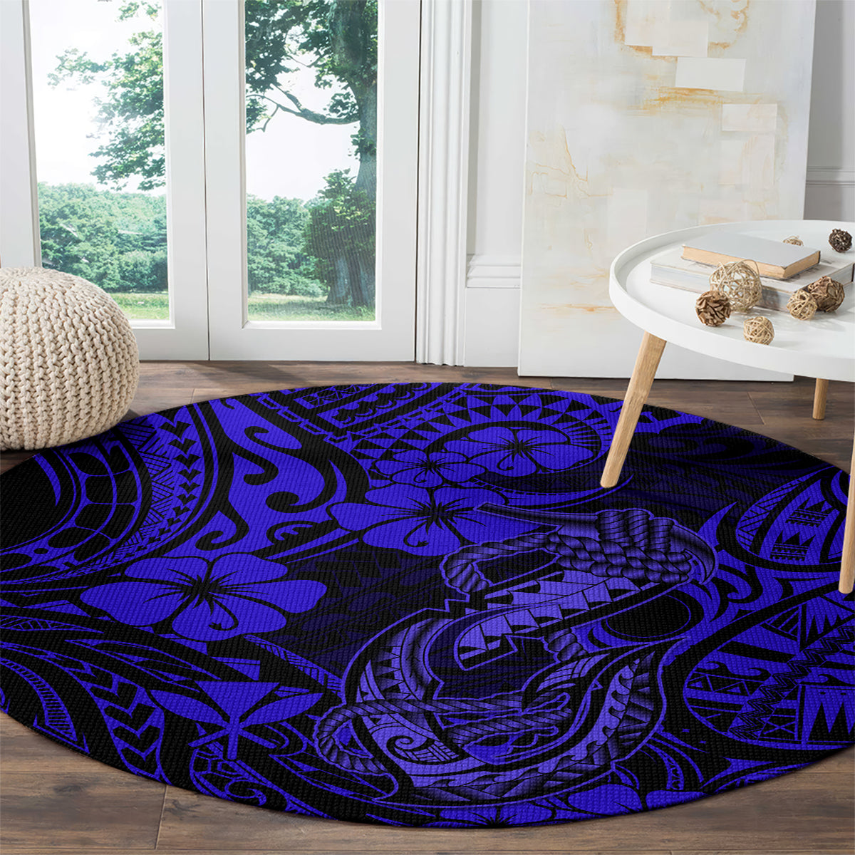 Round navy blue polynesian fish-hook patterned carpet with bold tribal swirls