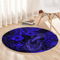 Round navy blue carpet with polynesian fish-hook motifs in dark and bright blue