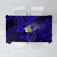 Navy blue tablecloth with Polynesian fish hook and floral pattern, rectangular.