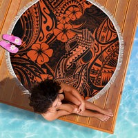 Orange-and-black circular beach blanket with Polynesian motif, white fringed border