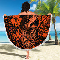 Orange circular beach blanket with black Polynesian pattern, white fringed edge