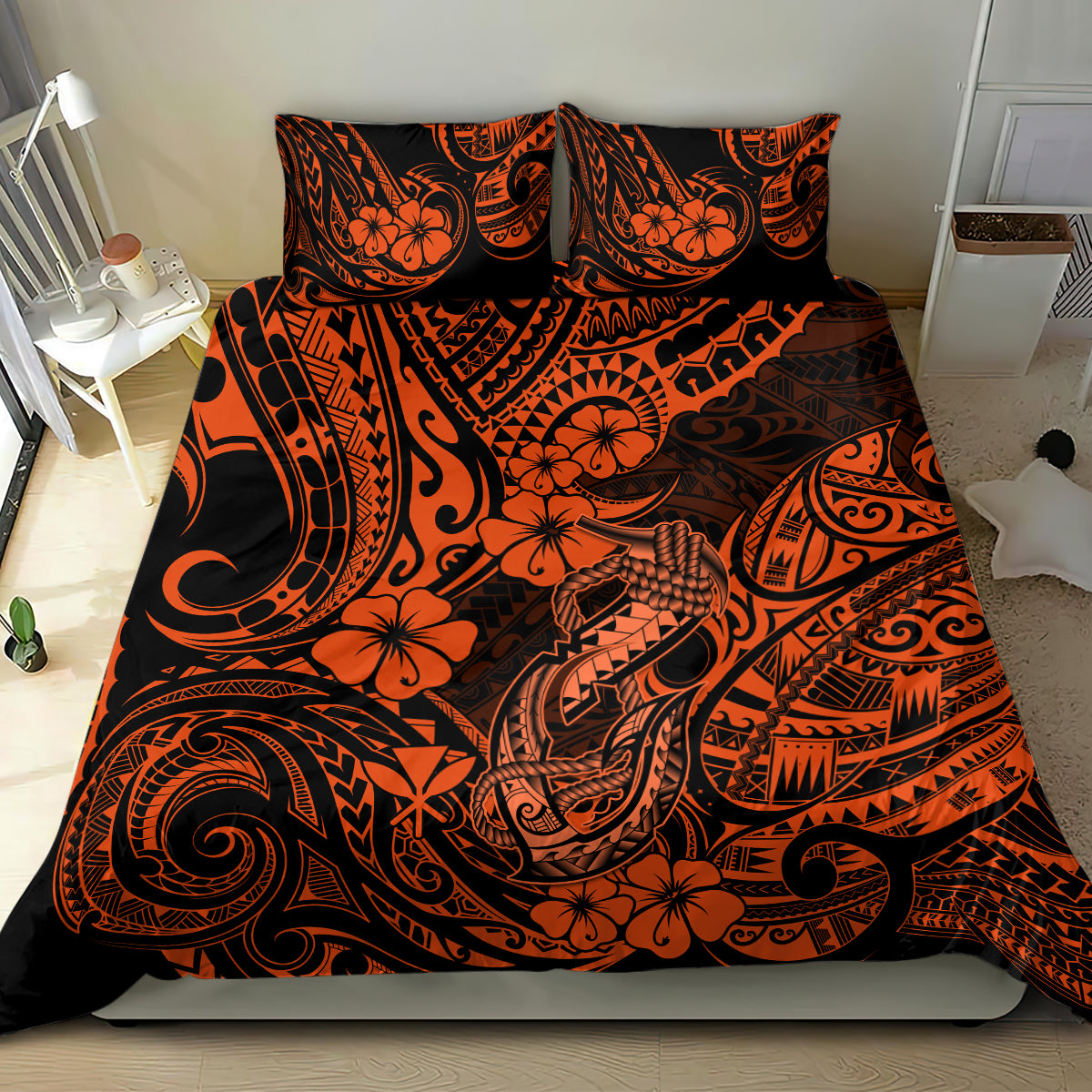 Orange and black Polynesian pattern bedding set with two pillowcases on bed