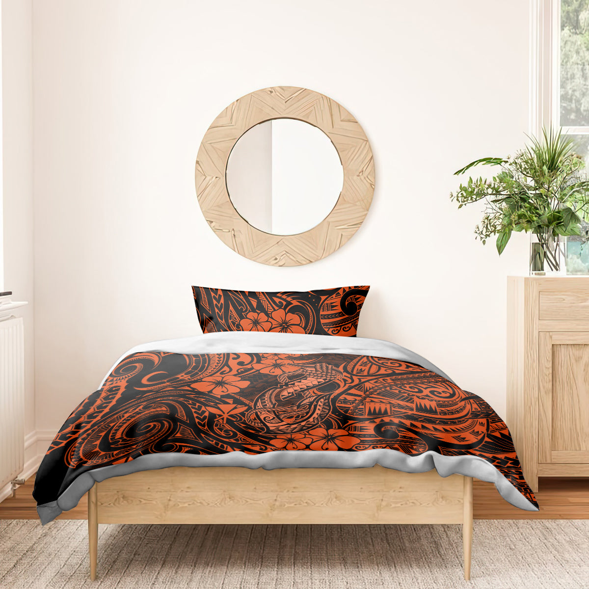 Orange and black Polynesian pattern duvet and pillowcase set on wooden bed