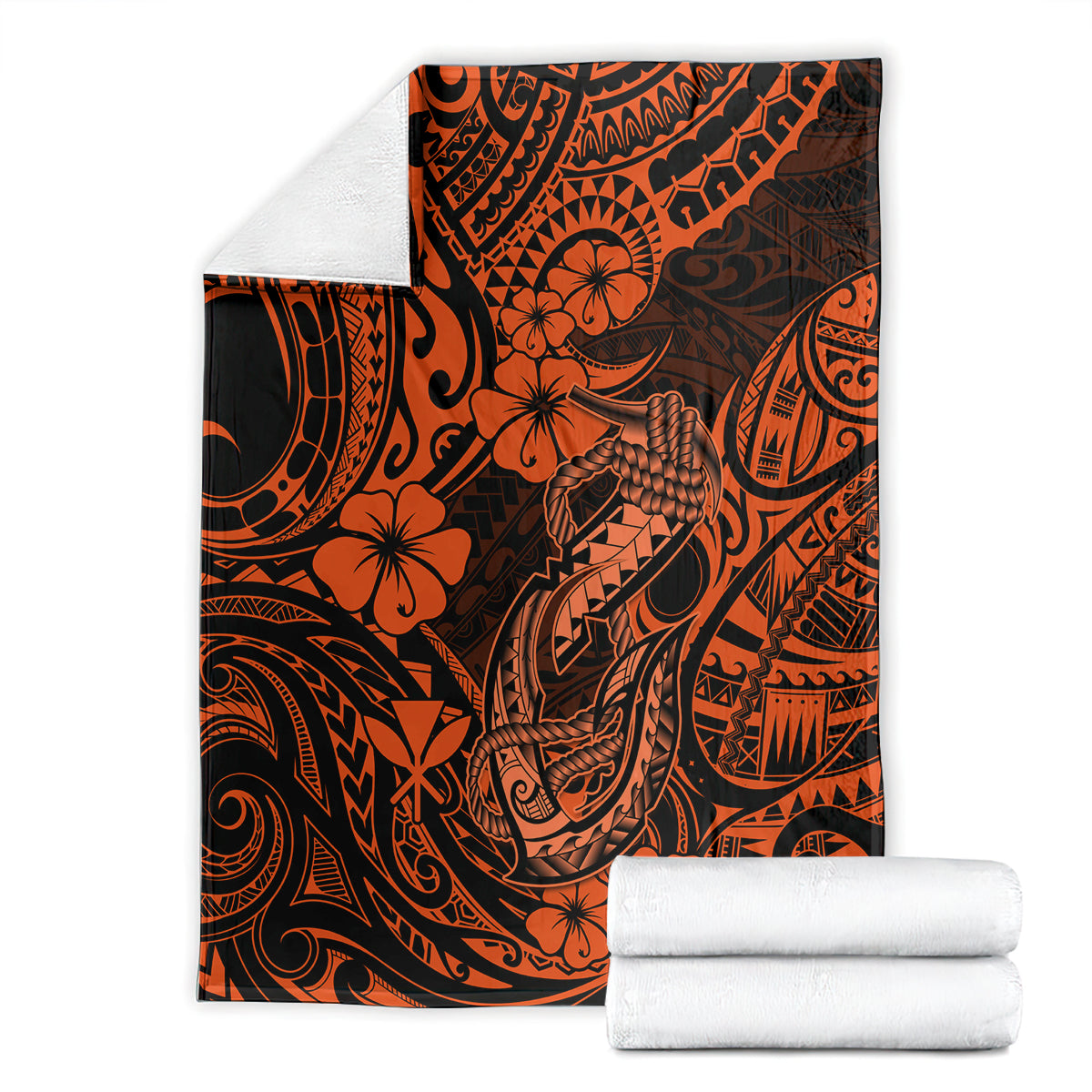 Orange and black fish hook patterned blanket with folded white towels