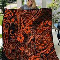 Orange and black Polynesian-pattern quilt with tiki-style swirls and flowers