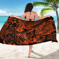 Orange and black polynesian-pattern sarong worn, back view with tied straps