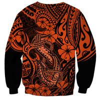 Orange and black graphic sweatshirt with ornate Polynesian pattern and fish hook artwork