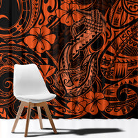 Orange and black Polynesian curtain fabric close-up with swirls and flower designs