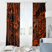 Orange and black Polynesian patterned curtains with hanging rings and floral swirls
