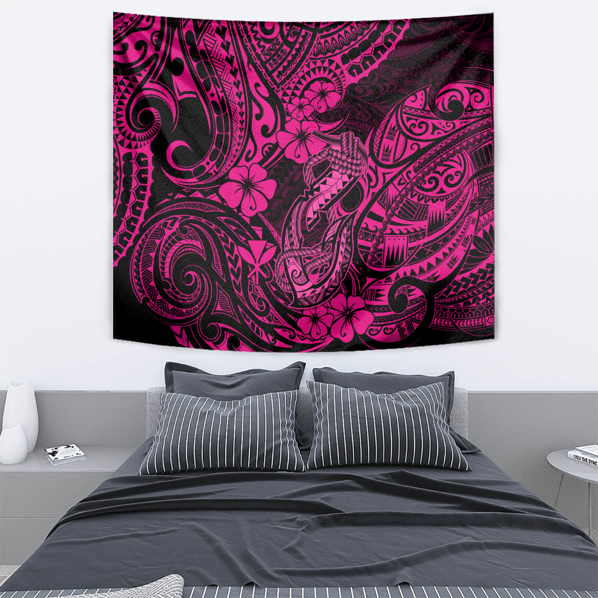 Rectangular wall tapestry in pink and black with swirling tribal pattern and hibiscus