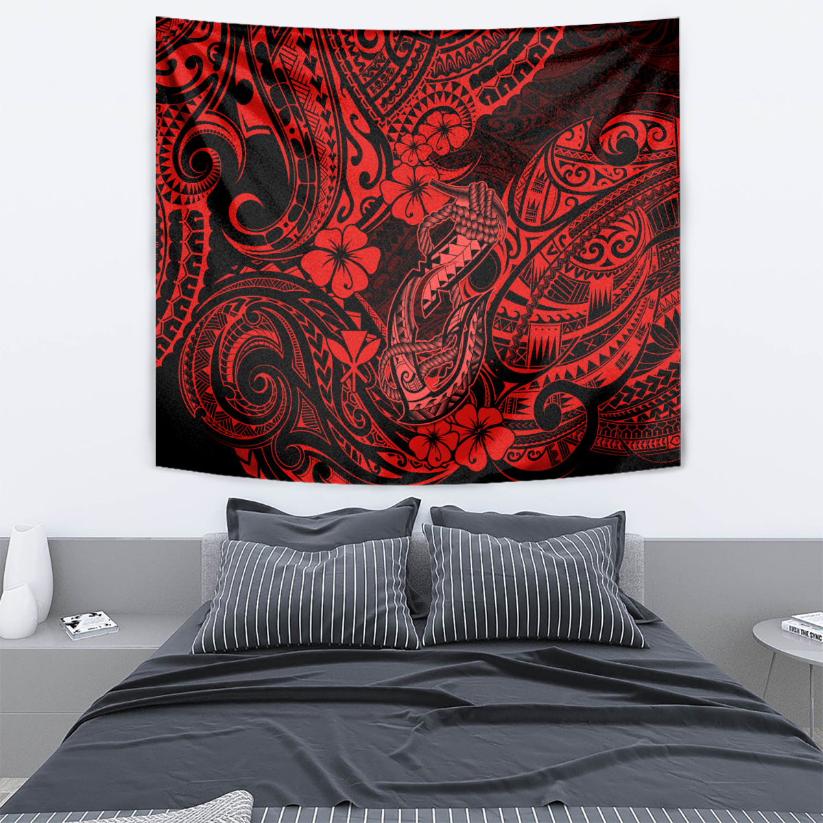 Red hibiscus and tribal fish hook tapestry wall hanging with intricate swirl motifs.