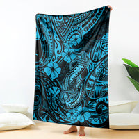 Blue patterned throw blanket with fishhook, hibiscus, and tribal tattoo-style design