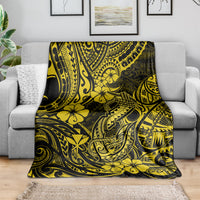 Yellow and dark hibiscus tribal throw blanket draped over a sofa