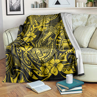 Yellow and dark hibiscus fishhook tribal throw blanket folded over a chair