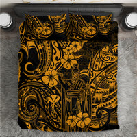 Gold and black Polynesian-style bedding set with duvet cover and pillow shams, close-up