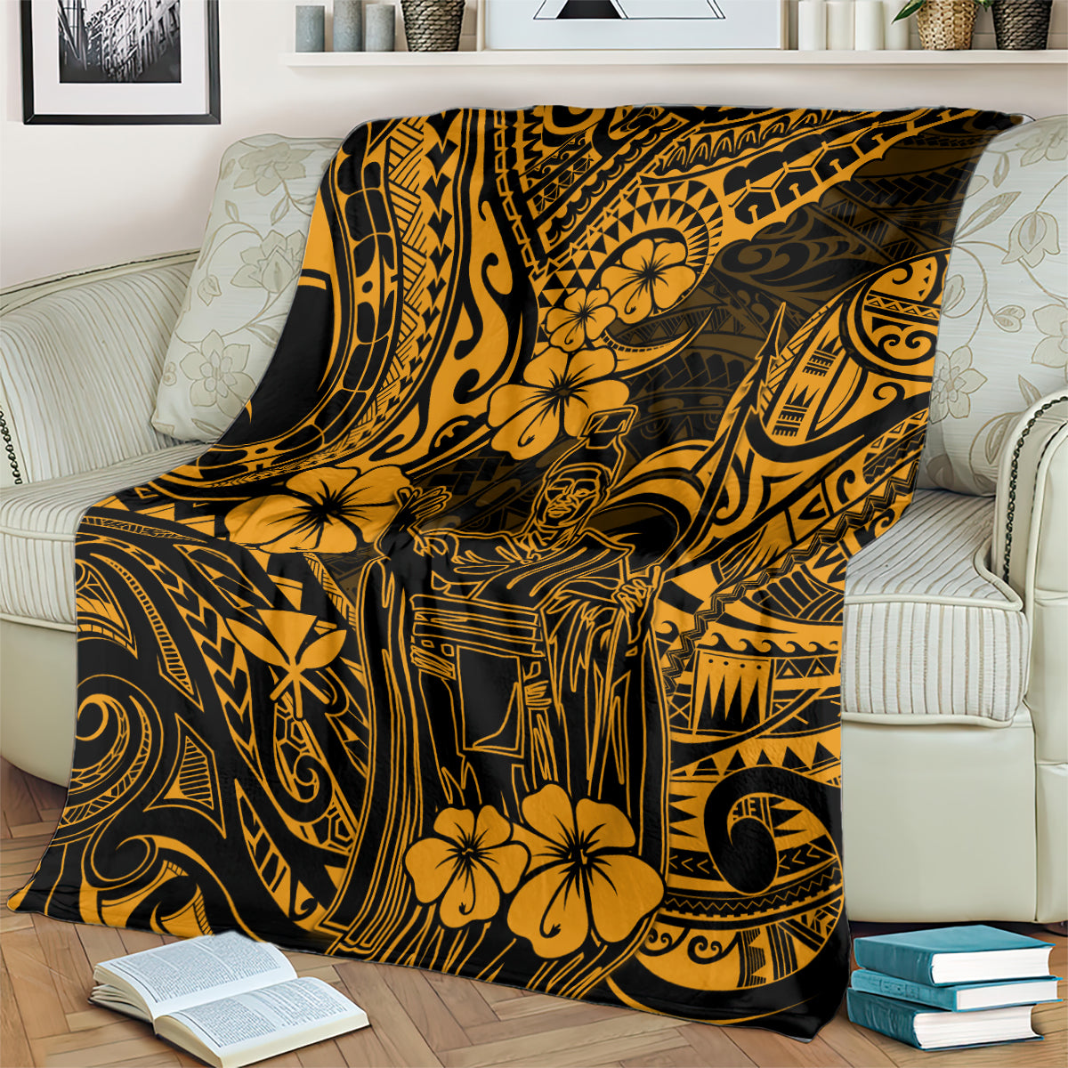 Gold and dark Polynesian pattern blanket draped on a couch with floral and tribal figure art