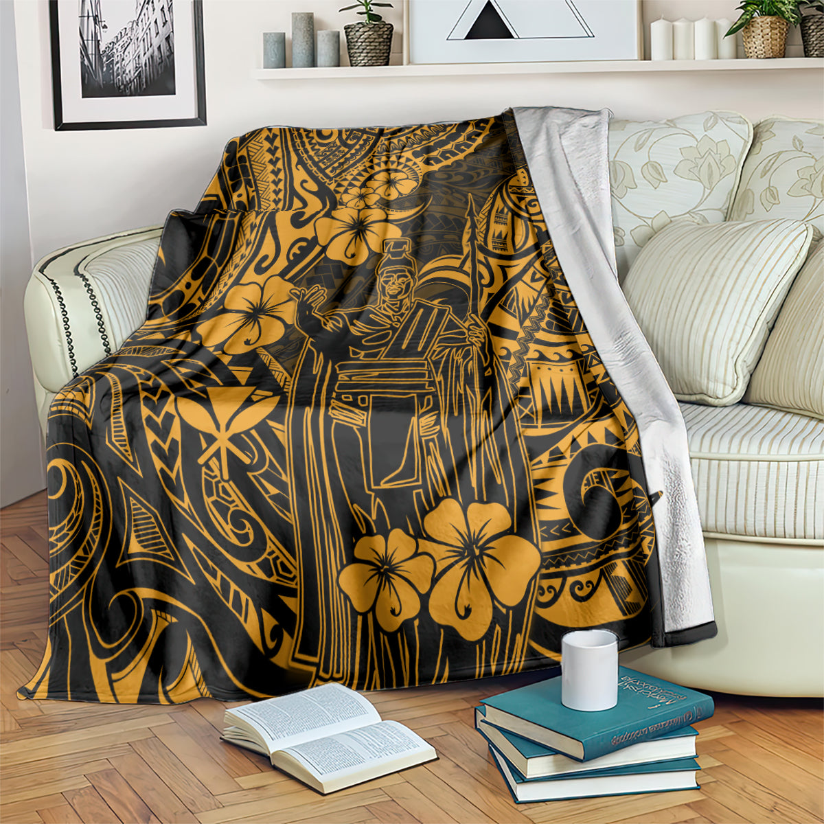 Gold and dark Polynesian pattern blanket draped on a bed with floral motifs and face emblem
